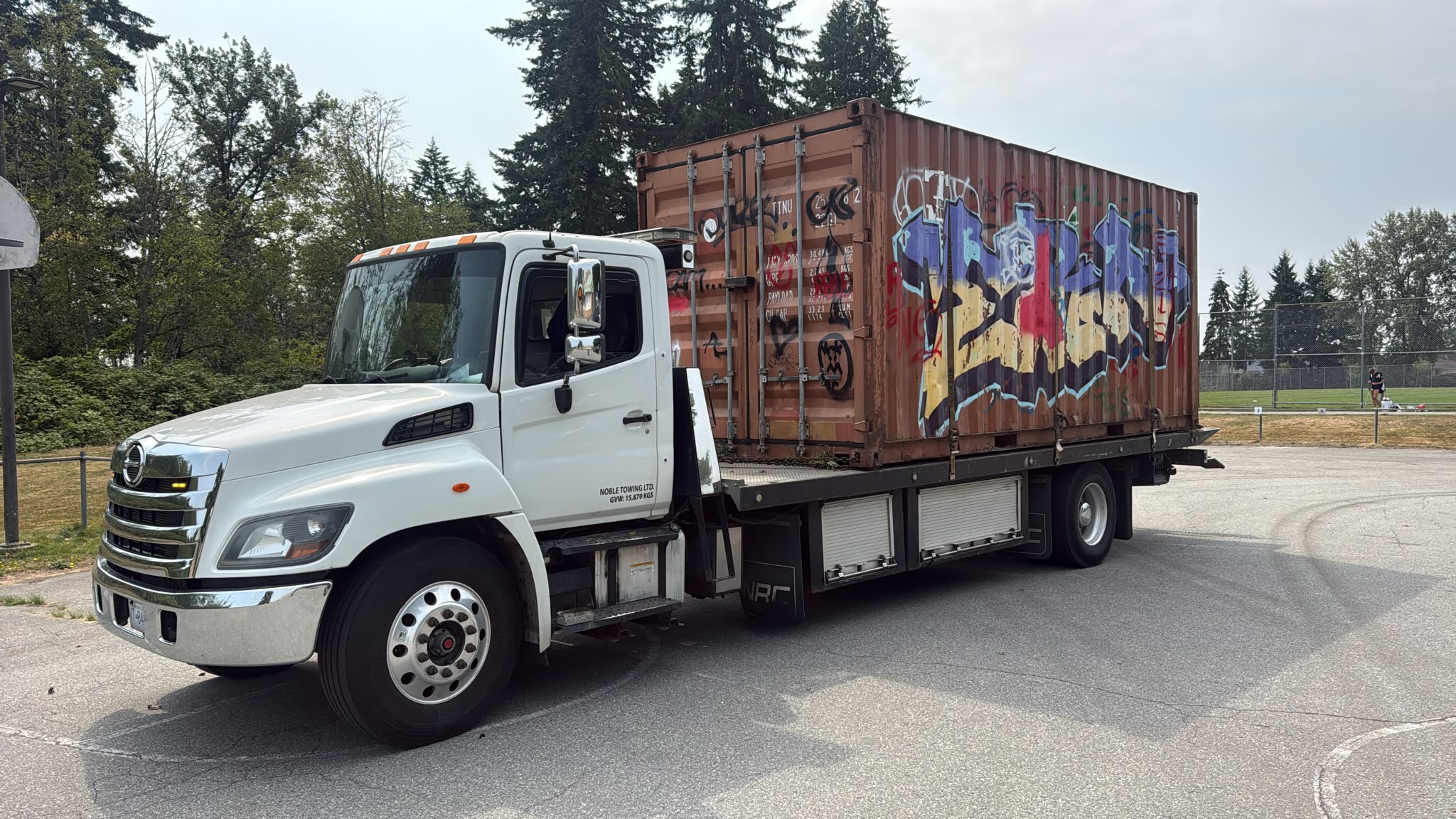 Shipping container being removed from a property in Metro Vancouver